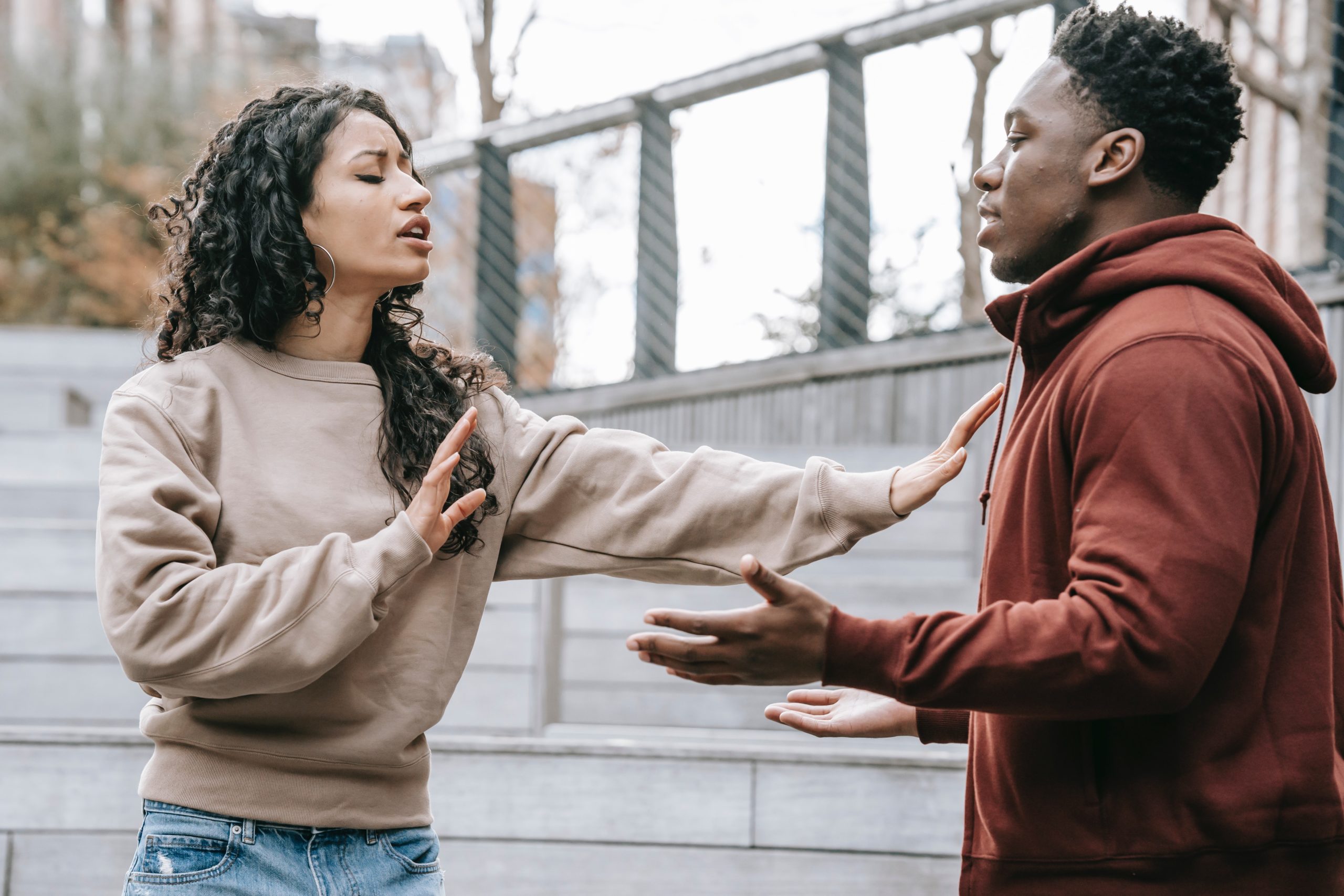 Photo by Keira Burton: https://www.pexels.com/photo/multiracial-couple-having-conflict-on-street-6147235/