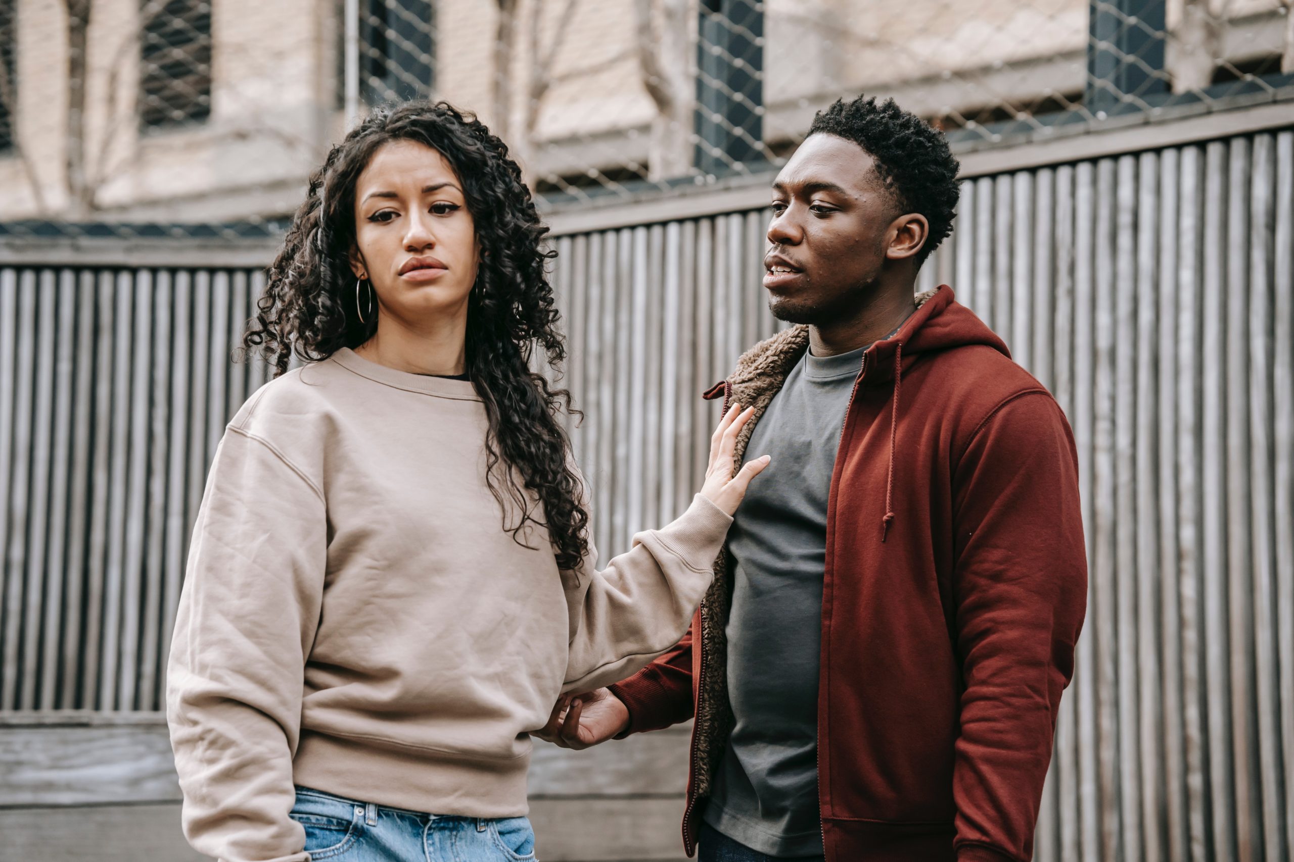 Photo by Keira Burton: https://www.pexels.com/photo/multiethnic-couple-having-quarrel-on-street-6147240/
